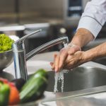 Cropped,Image,Of,Chef,Washing,Hands,At,Restaurant,Kitchen