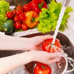 Fresh,Vegetables,Under,Water,Stream,In,Colander